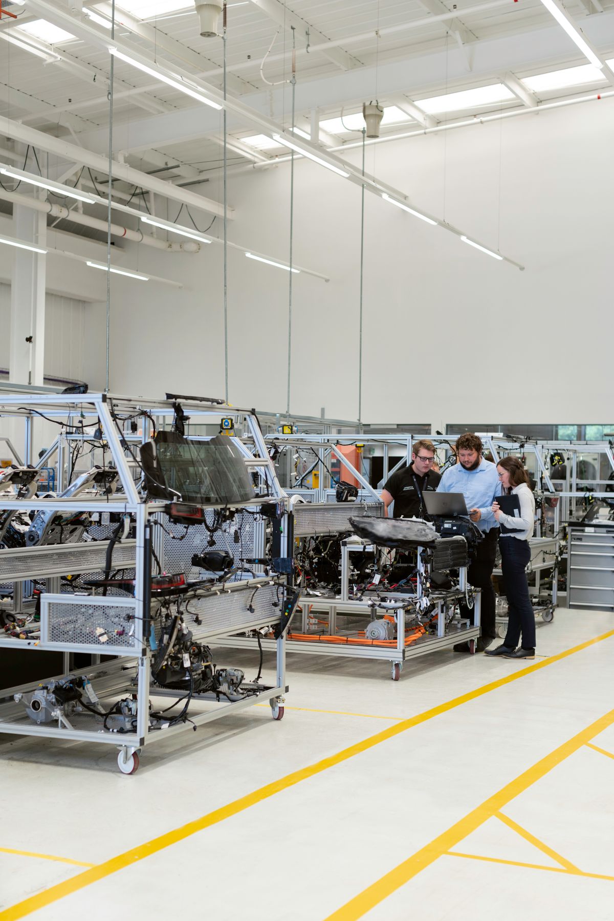 Engineering team working together on a manufacturing floor