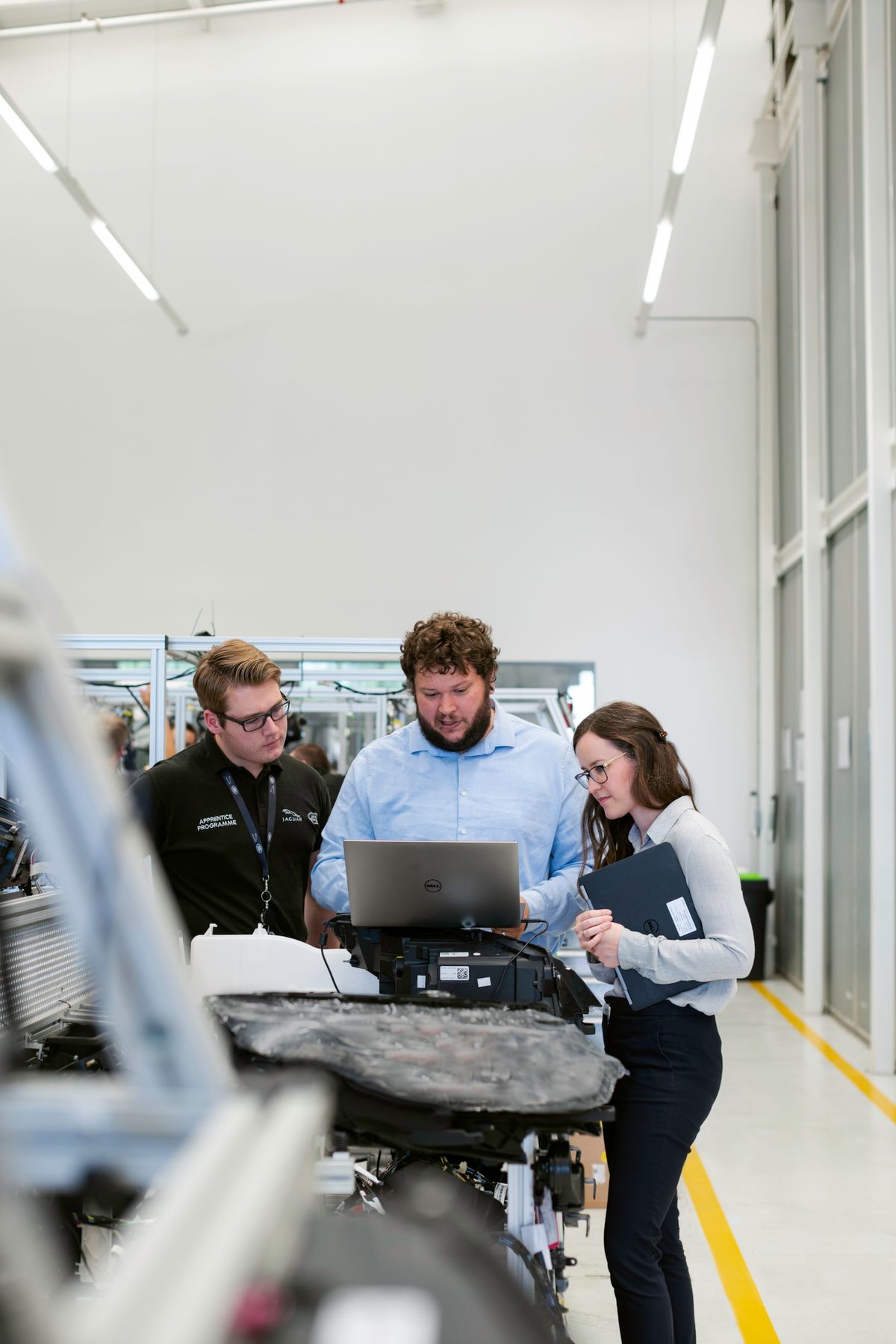 Manufacturing team reviewing production information