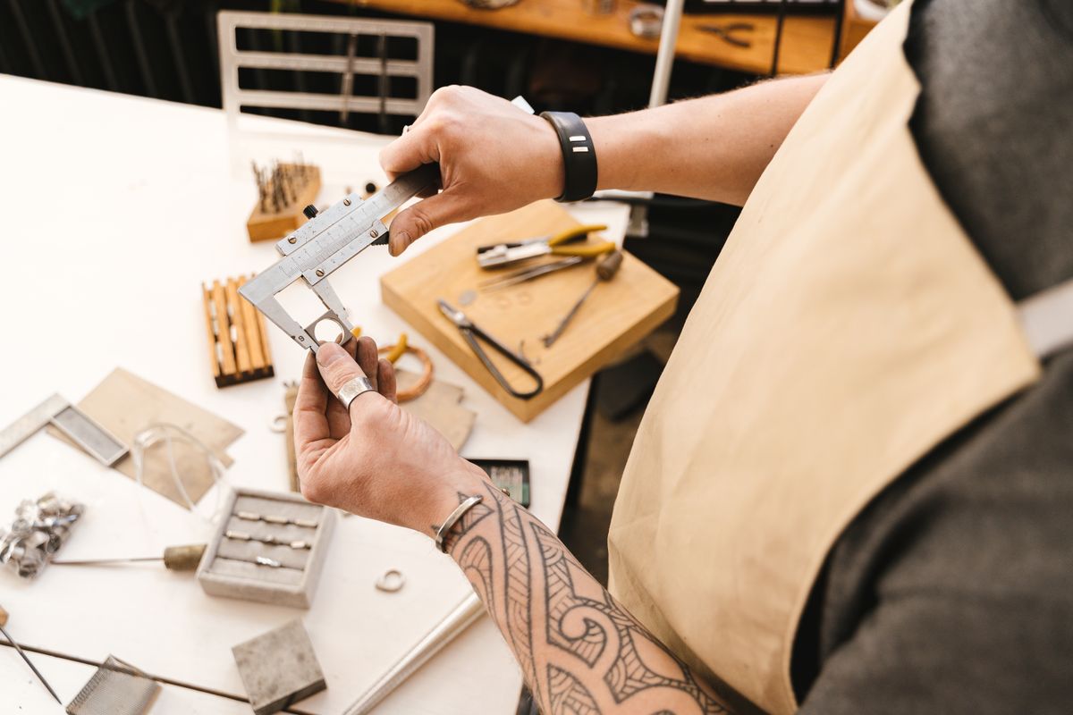 Close-up of a component being measured with calipers